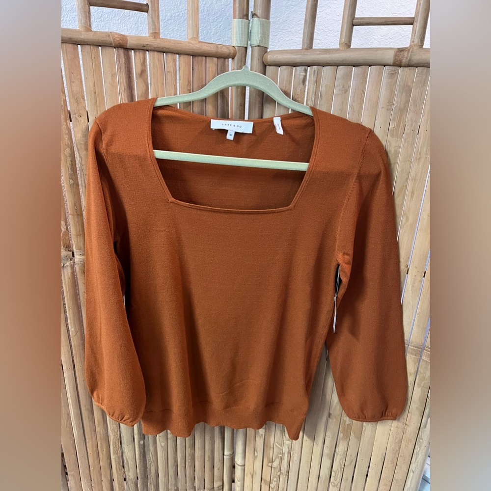 Lark and Ro. Gingercolor/ medium. Poly blend
